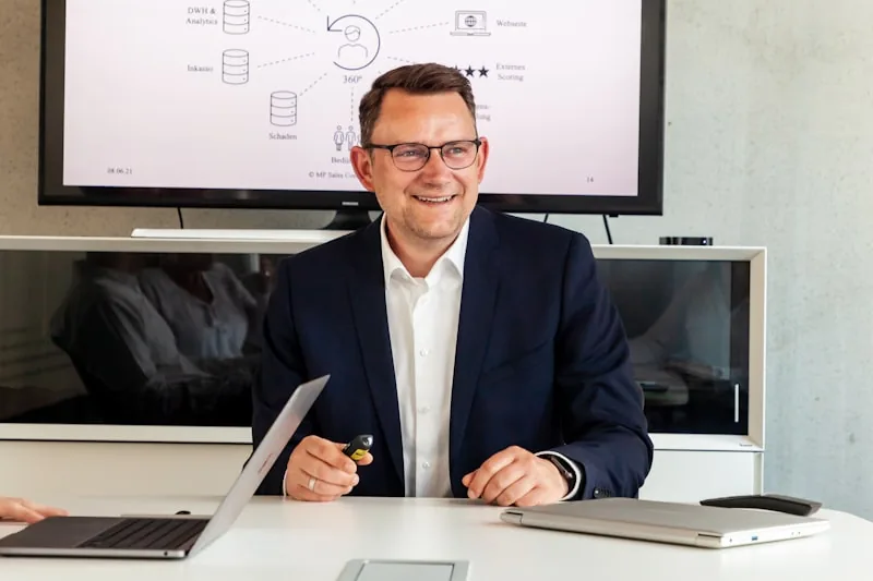 Sales representative working on a customer relationship management platform with contact data visible