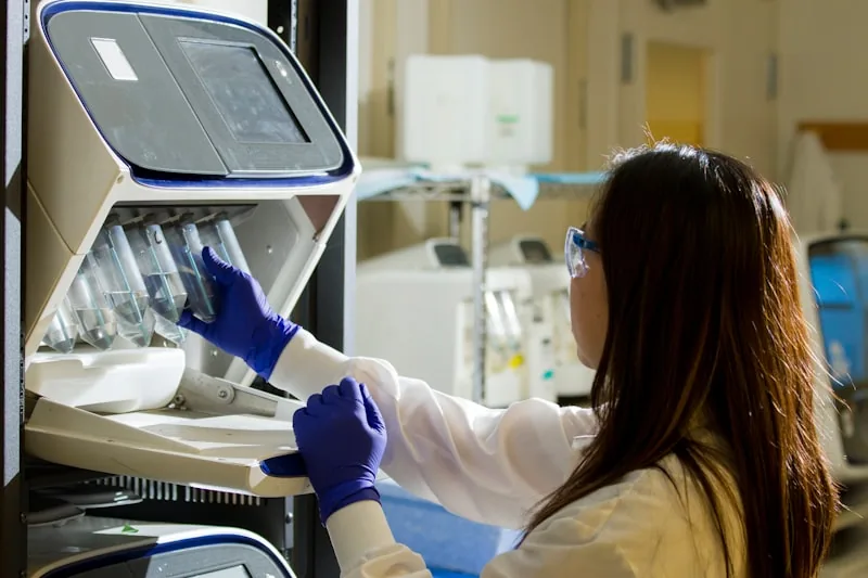 Someone demonstrating or testing a therapeutic medical device in a clinical or home setting