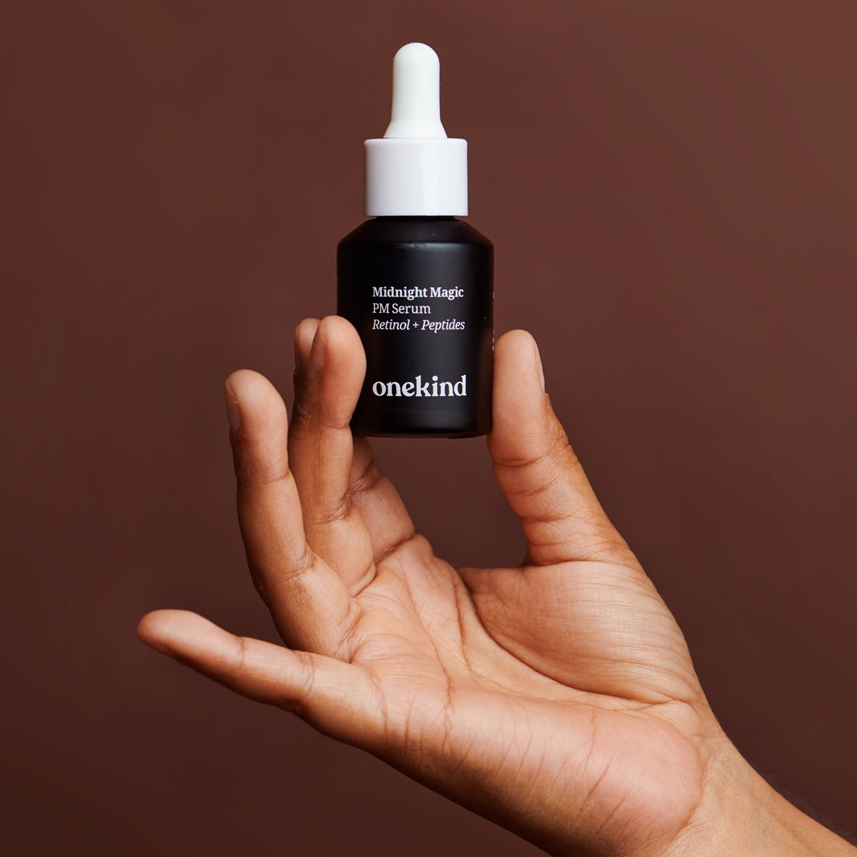 Onekind Midnight Magic PM Serum dropper bottle, a 0.1% retinol night serum